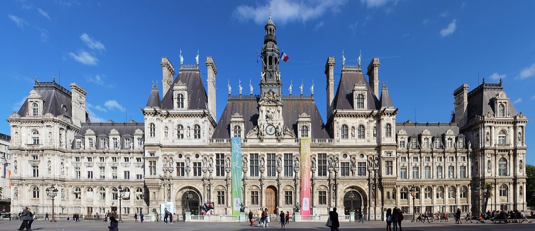 The Hôtel de Ville de Paris, its ornate facade in afternoon light