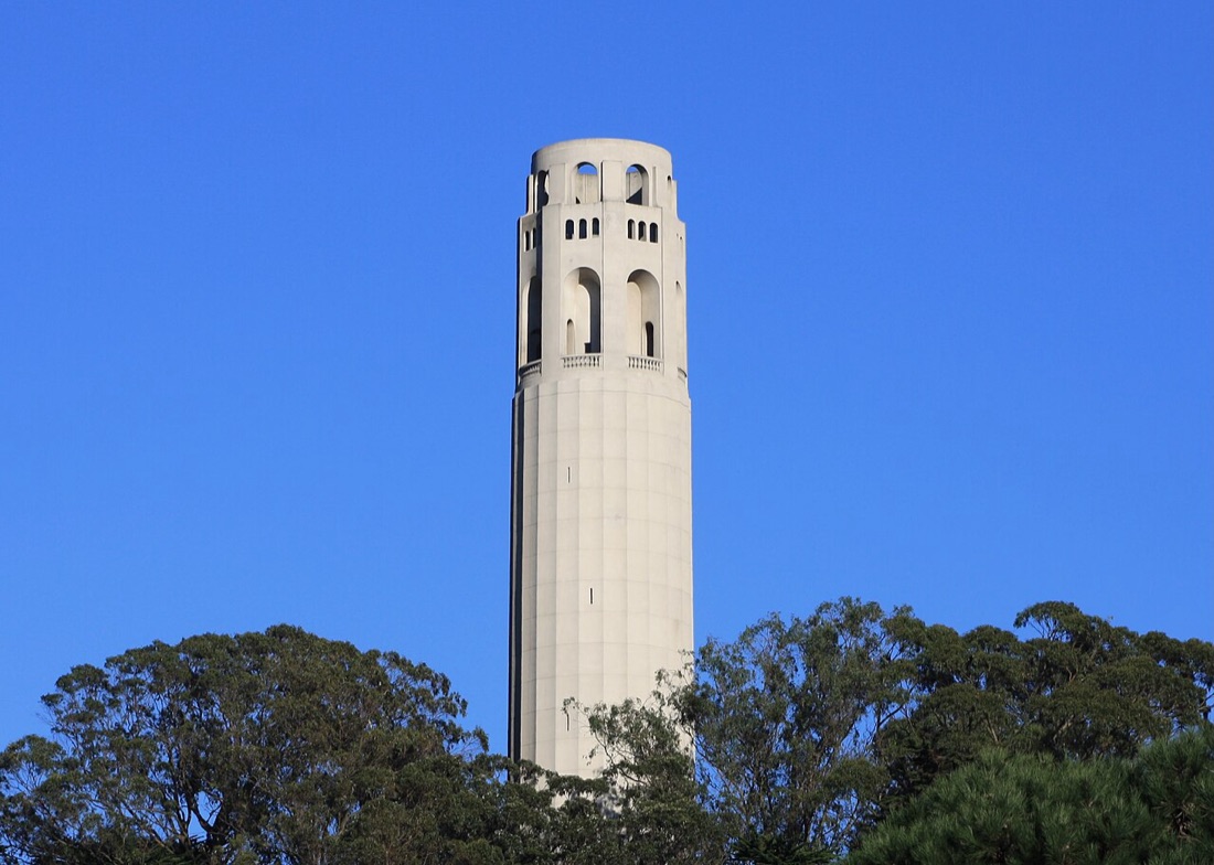Coit Tower rising above the trees of Telegraph Hill