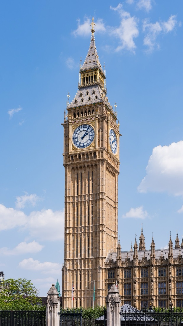 Big Ben and the north front of the Palace of Westminster under a blue sky